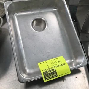 Stainless steel meat grinder feeder pan. Features a bottom feed chute with a 2½" opening. Dimensions: 10⅜" x 12¾".