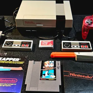 Nintendo Entertainment System Bundle with Controllers, Zapper, N64 Controller, Memory Card, and Duck