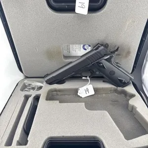 Taurus 1911 45ACP
One 8 round clip and case