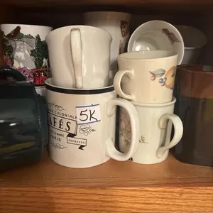 Shelf of coffee cups