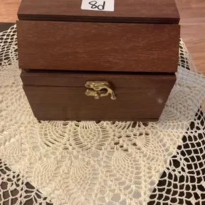Small wooden trunk like storage.  7x6
