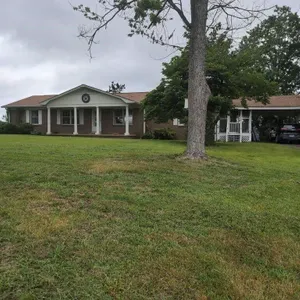 Brick house with carport shop and sitting on 2.3