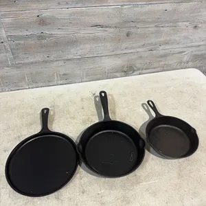 8” lodge cast iron skillet, 10” kitchenaid cast iron skillet and 10” lodge cast iron griddle