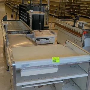 Borroughs metal checkout lane. Features a motorized belt conveyor, stainless steel transition tray, cash register platform, and woodgrain-style accent