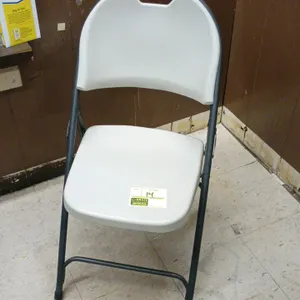Poly folding chair. Features a contoured light gray plastic seat and backrest with an integrated carrying handle. Mounted on a dark gray folding metal