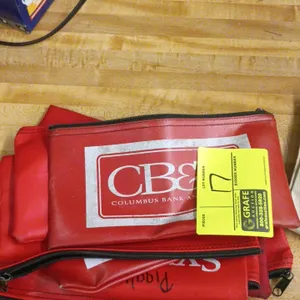 Collection of zippered vinyl and canvas bank bags. Includes red vinyl zippered deposit bags, featuring Columbus Bank and Trust (CB&T) branding, and ca