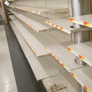 40'L of Madix wall shelving. 84"H uprights with 22"D base shelves. Features pegboard backing and adjustable upper shelves. Contents not included. Note