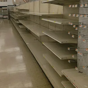 72'L of Madix gondola shelving. Features off-white finish, 78"H uprights, pegboard backing, and 25" base shelves. Contents and aisle signage not inclu