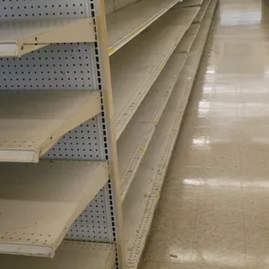 132'L of Madix gondola shelving. Features off-white finish, 72"H uprights, and 25"/25" double-sided base shelves with adjustable upper shelving and pe