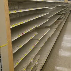 72'L of Madix gondola shelving. Features an off-white finish, 72"H uprights, and 25" base shelves. Contents and aisle signage not included. Note: Gond
