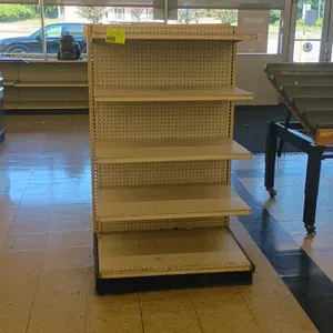 15'L of Madix gondola shelving. Features off-white finish, pegboard backing, 61"H uprights, and 25"D base shelves with adjustable upper shelves. Conte