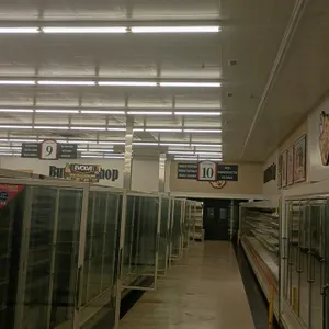 Quantity of Piggly Wiggly branded store aisle markers and hanging price signs. Includes double-sided aisle directory signs (numbers 3 through 10 visib