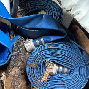 Several Blue Layflat Discharge Hoses with Coupler