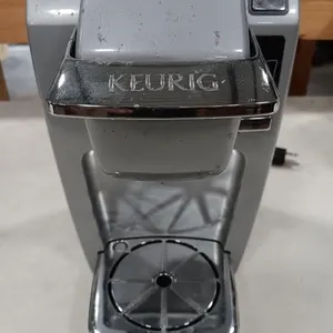 KEURIG coffee maker with K-cup holder and a
