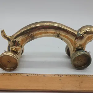 Vintage brass dashhound rolling wheeled back massager