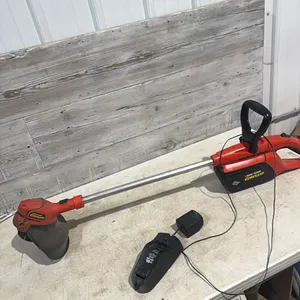 Cordless weed trimmer woth charger worked when tested