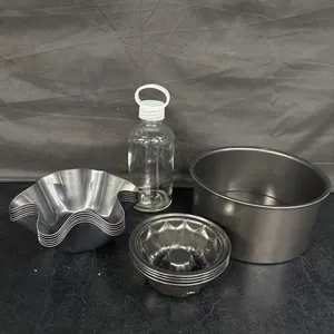 Tin baking dishes and glass bottle - look new
