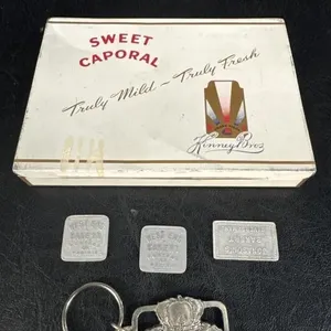 1 metal cigar tin, bread token for Jonason's