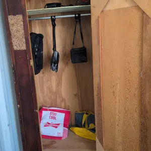 Wooden Wardrobe Locker With Assorted Bags and Backpack