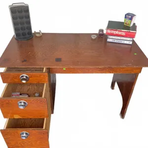 Desk With Three Drawers and Assorted Accessories