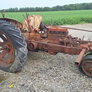 Case tractor with row crop cultivator