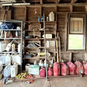 Rain Train Lawn Sprinkler, Metal Shelf, Gas Cans,