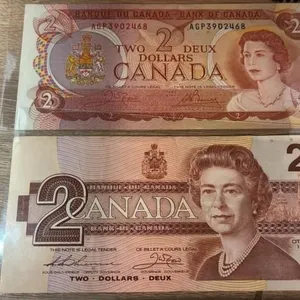 2 Uncirculated Canada $2 Notes.