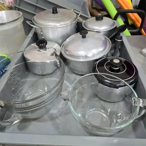 5 cooking pots and 2 glass measuring bowls