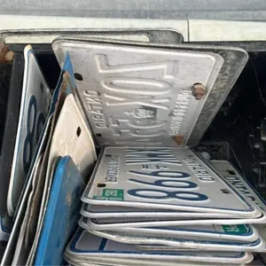 Crate of assorted license plates