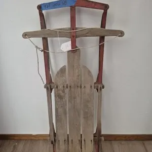 Red Metal and Wood Sled