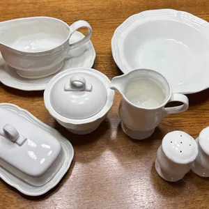 White Ceramic Tableware Set Including Butter Dish, Gravy Boat, and More