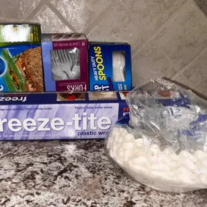 Household Items Lot: Plastic Wrap, Storage Bags, Utensils, and Cotton Pads