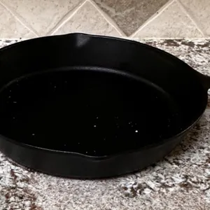 Lodge Cast Iron Skillet with Dual Handles and Marked Bottom
