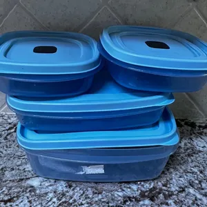 Four Blue Plastic Food Storage Containers With Lids