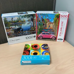 Three Jigsaw Puzzles: 1000-Piece Darrell Bush Blue Sky Reflection, 500-Piece RoseArt Colorluxe Trave