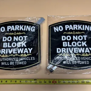 (2) Yuzkouge No Parking, Do Not Block Driveway Signs packaged with detachable mounting stakes.