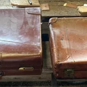 2 vintage brown hard-sided suitcases