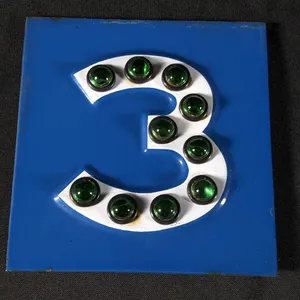 PORCELAIN #3 SIGN WITH GREEN GLASS MARBLE REFLECTORS
