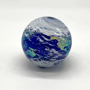 Signed Earth-Themed Glass Paperweight