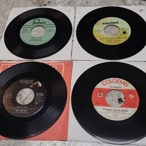 8 45 RPM Records Featuring Wayne Fontana, Robert Mitchum, The Monkees, and Mr. Mister Singles
