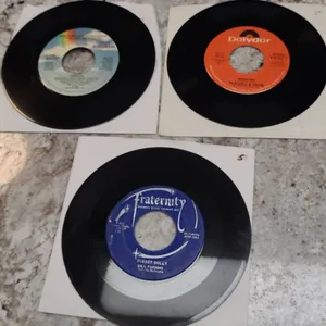 Three 7-Inch 45 RPM Singles: Pebbles “Mercedes Boy”, Peaches & Herb “Reunited”, Bill Parsons “Rubber