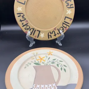 2 Primitive Wooden Plates, one signed Debbie Grogan