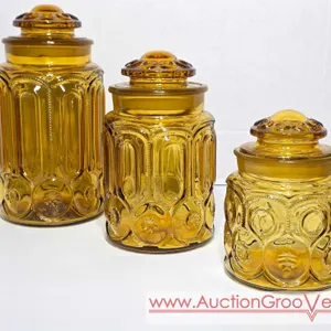 Vintage Moon and Star Amber Glass Jars. Each lid has 1 or 2 Small chips on the rim. LR