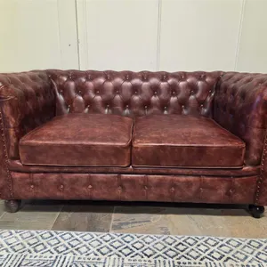 Brown Tufted Chesterfield-Style Leather Loveseat
 UNRESERVED