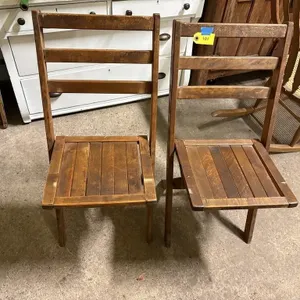 2 wooden folding chairs
