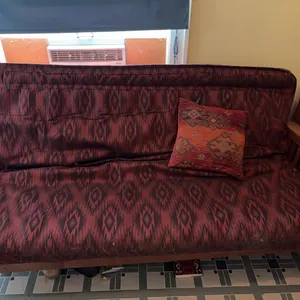 Wood-Frame Futon Sofa with Red Ikat-Patterned Upholstery
