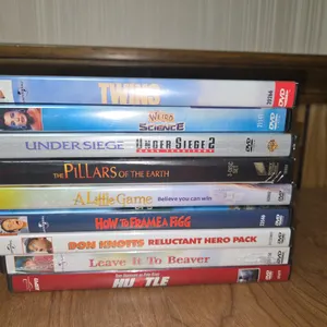 A LOT OF DVD'S INCLUDING TWINS, WEIRD SCIENCE, THE PILLARS OF THE EARTH, A LITTLE GAME, LEAVE IT TO