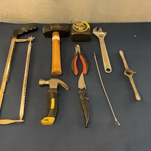 Hand saw, hammers, and wrench