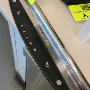 Kitchenstar 18" stainless steel rocking pizza cutter. Features rolled stainless steel handle and protective blade cover.