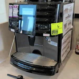 Schaerer SCAP Steam commercial espresso machine. Features dual top bean hoppers, digital touchscreen interface, and stainless steel drip tray. S/N: 22